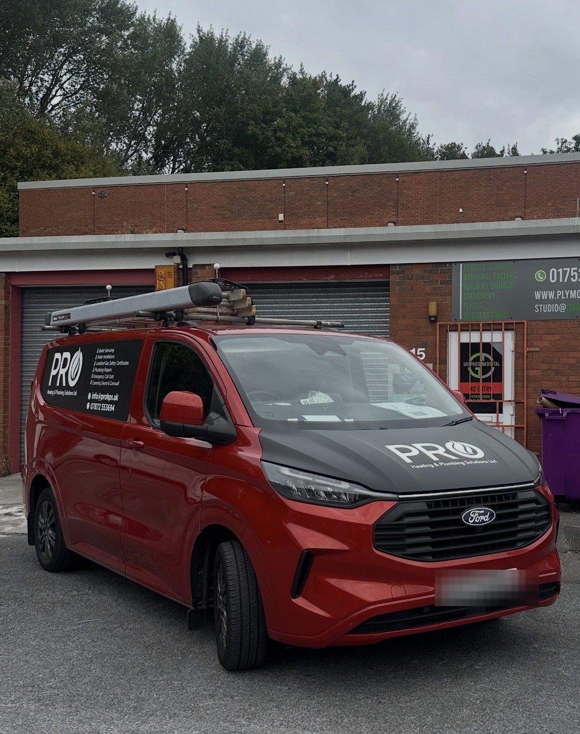 Dale's red Ford Transit Custom van, signwritten with the Pro Heating & Plumbing Solutions Ltd logo and contact details